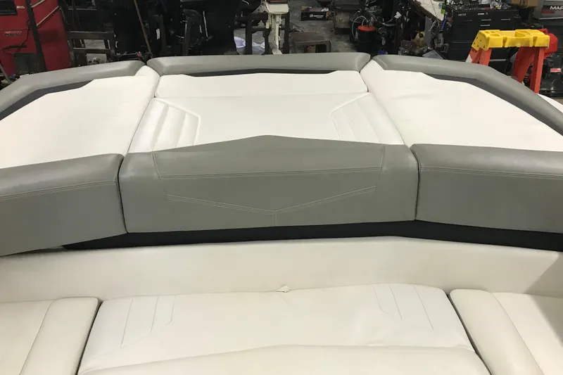 Slide: The Image of 2015 Four Winns H230 boat interior with gray and white cushioned seating. - 44