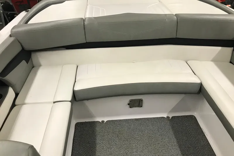 Slide: The Image of 2015 Four Winns H230 boat interior with gray and white seating. - 46