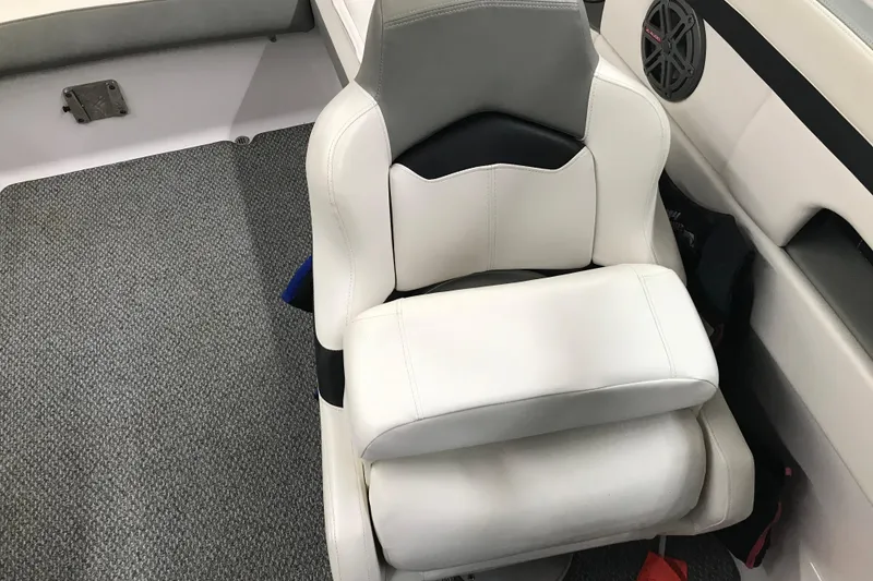 Slide: The Image of White and gray captain's chair in 2015 Four Winns H230 boat interior. - 49