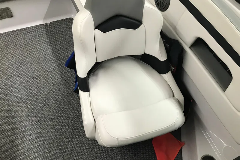 Slide: The Image of White leather seat in 2015 Four Winns H230 boat interior, gray carpet flooring. - 50