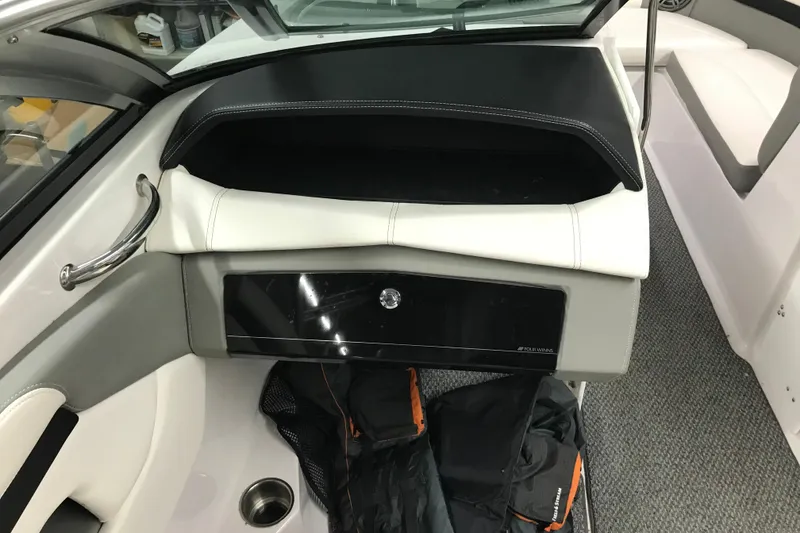 Slide: The Image of Interior of 2015 Four Winns H230 boat with seating and storage compartment. - 53