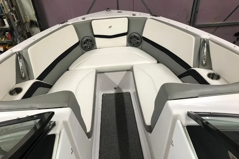 Slide: The Image of Interior of 2015 Four Winns H230 boat with white seating and cup holders. - 55