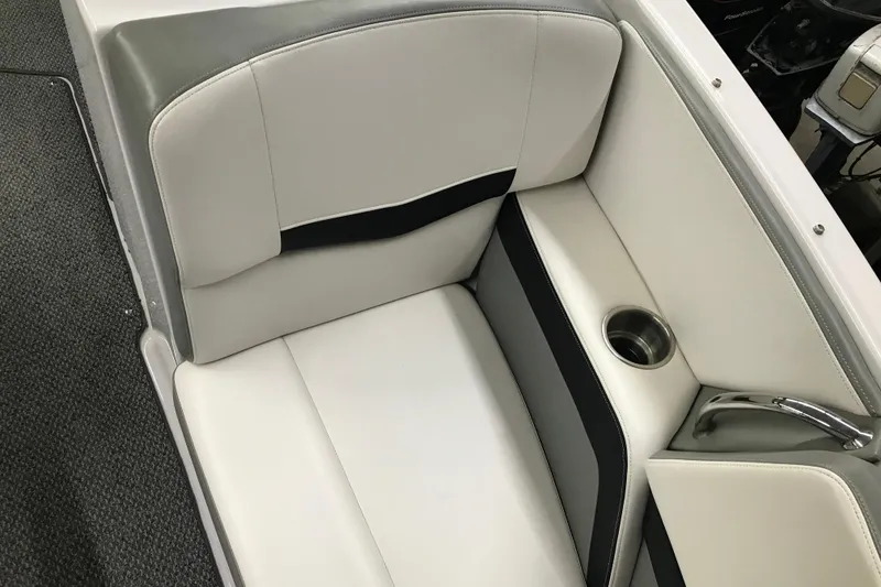 Slide: The Image of 2015 Four Winns H230 boat interior seating with cup holder and sleek design. - 72