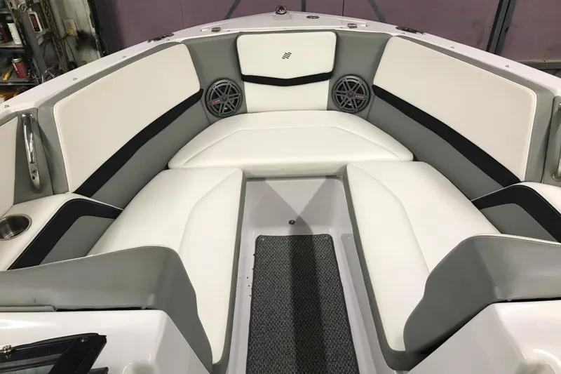 Slide: The Image of Interior of 2015 Four Winns H230 boat with white and gray seating. - 77