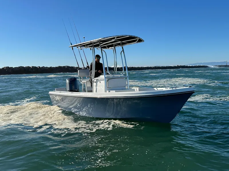 Slide: The Image of 2024 Parker 1801 Center Console boat cruising on open water. - 0