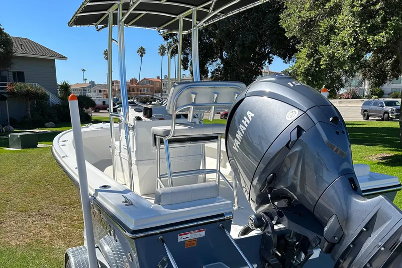 Slide: The Image of 2024 Parker 1801 Center Console boat with Yamaha outboard motor on a sunny day. - 2