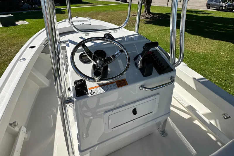 Slide: The Image of 2024 Parker 1801 Center Console boat interior with steering wheel and controls. - 7