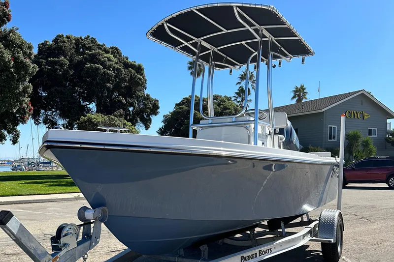 Slide: The Image of 2024 Parker 1801 Center Console boat on a trailer, parked outdoors. - 8