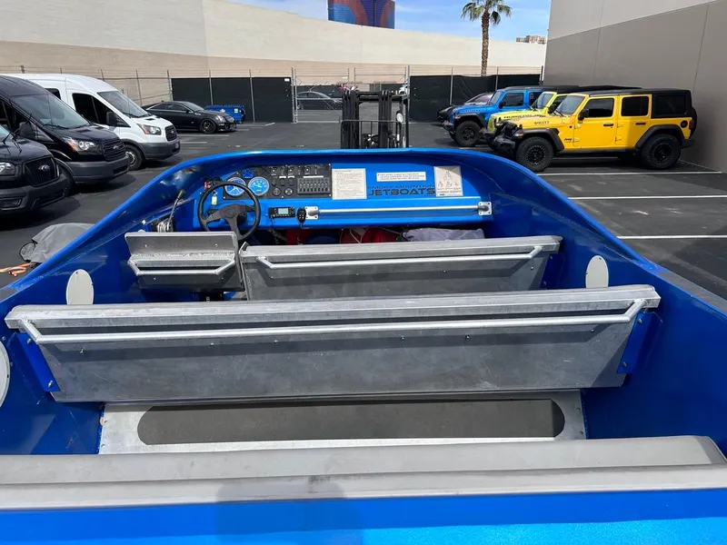 Slide: The Image of Blue 2021 Smoky Mountain 12 Passenger jet boat interior in parking lot. - 3