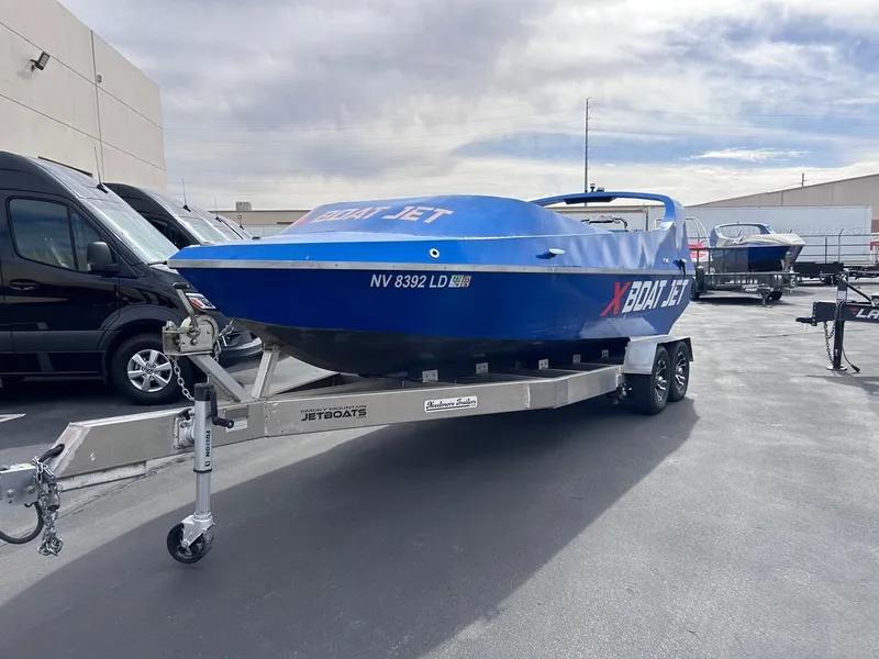 Slide: The Image of Blue 2021 Smoky Mountain 12 Passenger boat on trailer in parking lot. - 4