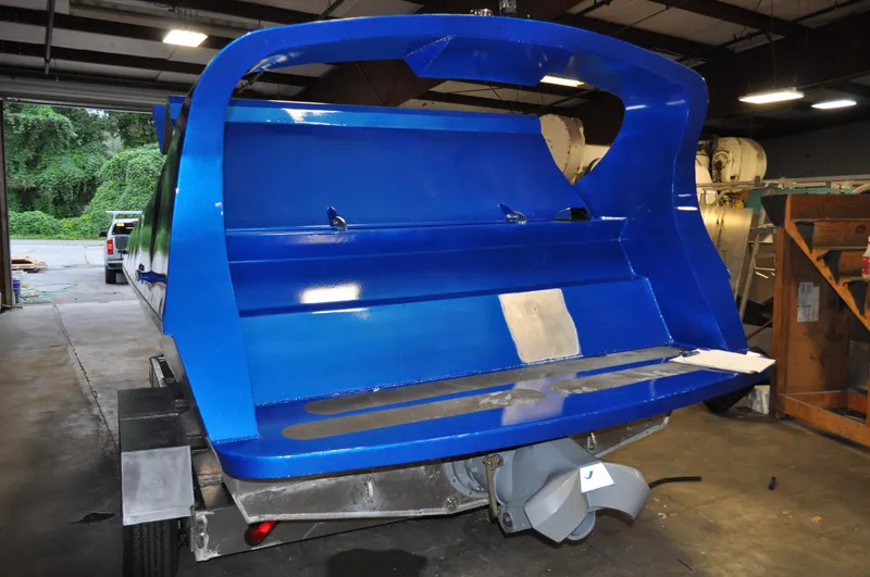 Slide: The Image of Blue 2021 Smoky Mountain 12 Passenger boat in a warehouse, rear view. - 8
