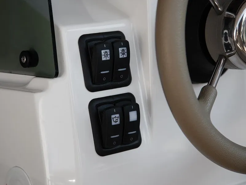 Slide: The Image of Control panel of a 2014 Capelli 460 boat with switches and steering wheel. - 10