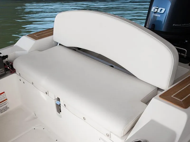 Slide: The Image of White seating area on 2014 Capelli 460 boat with Yamaha engine in background. - 3