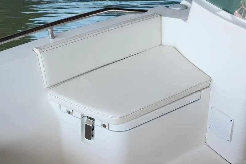 Slide: The Image of White cushioned seat on 2014 Capelli 460 boat, featuring sleek design and stainless steel railing. - 5