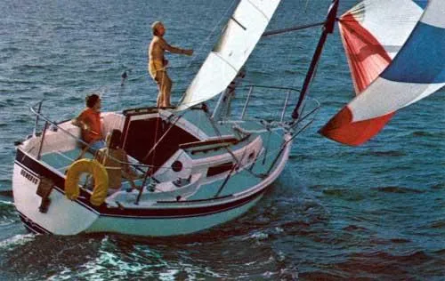 Slide: The Image of Sailing on a 1981 CAL 25II Mk II yacht with colorful spinnaker in open water. - 11