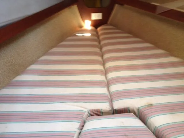 Slide: The Image of Interior cabin of 1981 CAL 25II Mk II sailboat with striped cushions. - 5