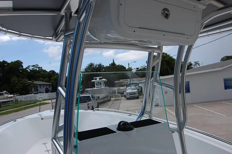 Slide: The Image of 2025 Cape Horn 22 OS boat with T-top and console in a marina. - 6