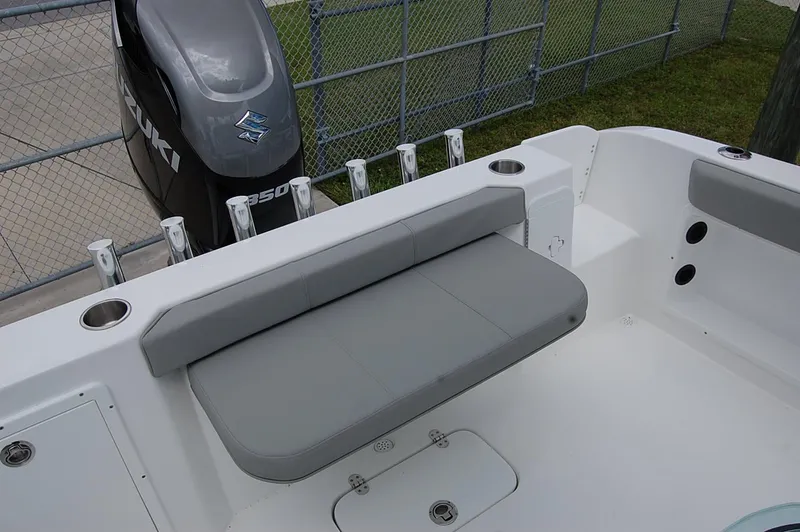 Slide: The Image of 2025 Cape Horn 22 OS boat with Suzuki outboard motor and cushioned seating. - 8