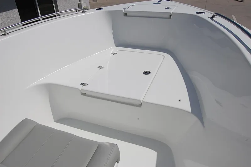 Slide: The Image of 2025 Cape Horn 22 OS boat interior with storage compartment and seating. - 9