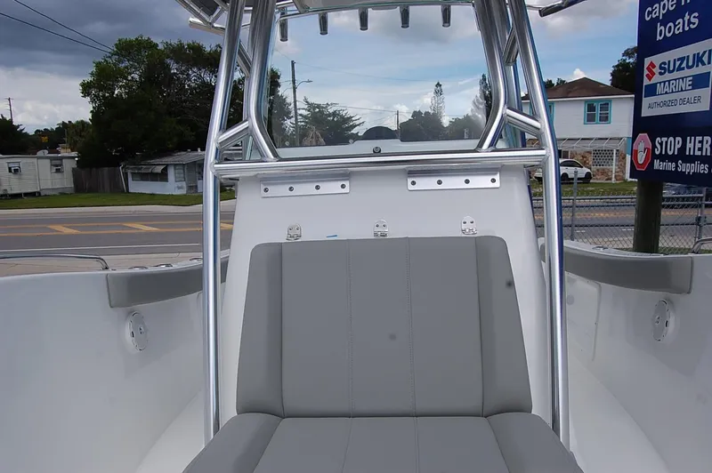 Slide: The Image of 2025 Cape Horn 22 OS boat interior with gray seating and stainless steel frame. - 12