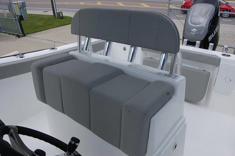 Slide: The Image of Cape Horn 22 OS 2025 model boat with gray cushioned seating and steering wheel. - 5