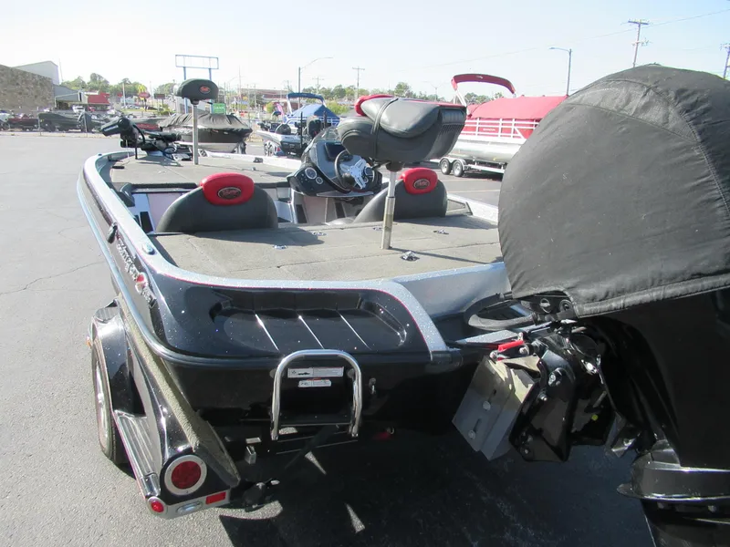 Slide: The Image of 2014 Ranger Z118C fishing boat with covered motor, parked outdoors. - 5