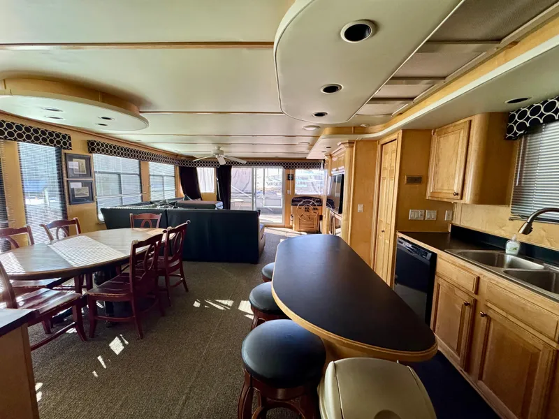 Slide: The Image of Luxurious 2006 Sumerset Seas The Day Share 7 houseboat interior with kitchen and dining area. - 29