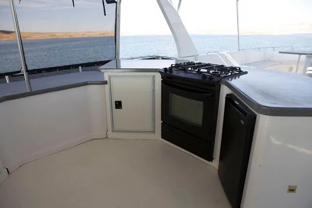 Slide: The Image of 2006 Sumerset Seas The Day Share 7 yacht kitchen with stove and ocean view. - 8