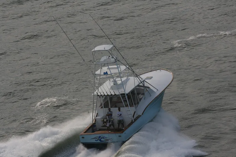 Slide: The Image of 2024 Jersey Cape Devil 45-Express Custom boat cruising on water. - 13