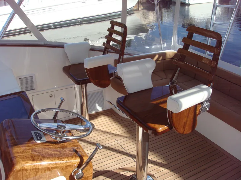 Slide: The Image of 2024 Jersey Cape Devil 45-Express Custom yacht interior with wooden helm chairs. - 14