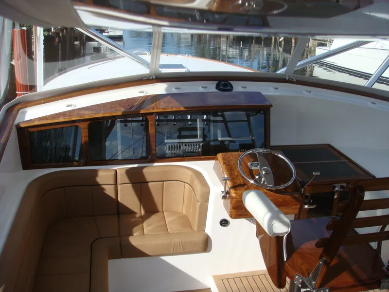 Slide: The Image of 2024 Jersey Cape Devil 45-Express Custom boat interior with helm and seating area. - 16