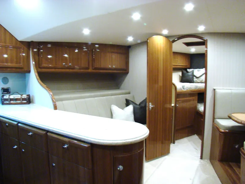 Slide: The Image of 2024 Jersey Cape Devil 45-Express Custom yacht interior with luxurious wood finish and modern amenities. - 19