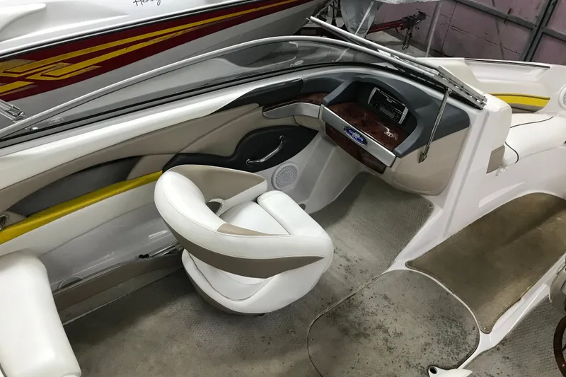 Slide: The Image of 2005 Four Winns 190 Horizon boat interior with sleek dashboard and comfortable seating. - 15
