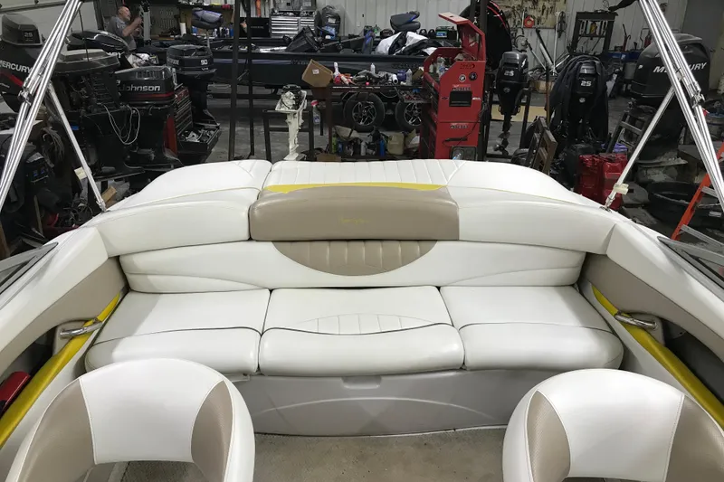 Slide: The Image of Interior of a 2005 Four Winns 190 Horizon boat with white seating. - 23