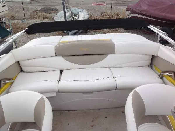 Slide: The Image of Interior of a 2005 Four Winns 190 Horizon boat with white seating. - 4