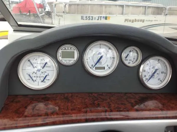 Slide: The Image of Dashboard of a 2005 Four Winns 190 Horizon boat with gauges. - 5