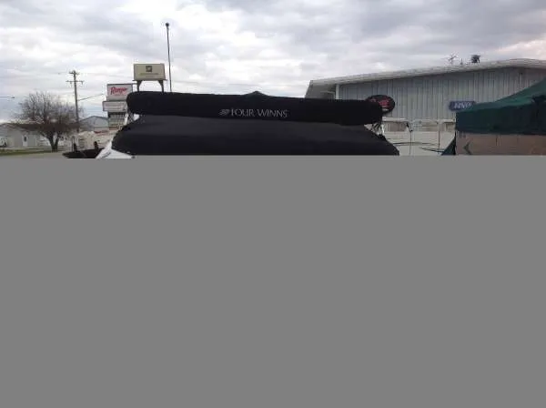 Slide: The Image of 2005 Four Winns 190 Horizon boat with cover outdoors. - 6