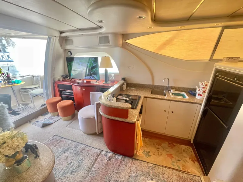 Slide: The Image of Luxurious interior of a 1998 Maxum 4100 SCA yacht with modern amenities. - 17
