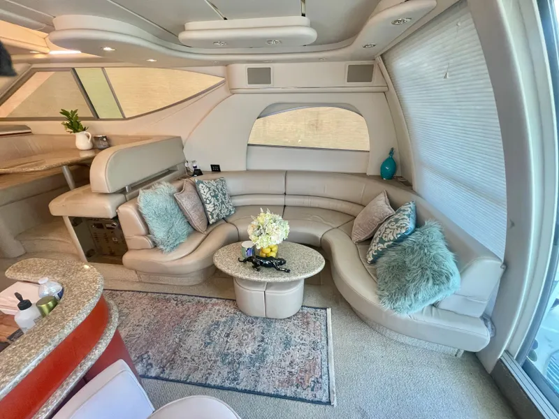 Slide: The Image of Luxurious interior of 1998 Maxum 4100 SCA yacht with plush seating and elegant decor. - 18