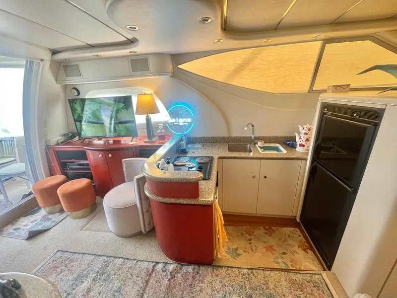 Slide: The Image of Luxurious interior of a 1998 Maxum 4100 SCA yacht with modern amenities. - 19