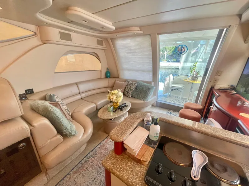 Slide: The Image of Luxurious interior of 1998 Maxum 4100 SCA yacht with elegant seating and modern amenities. - 20