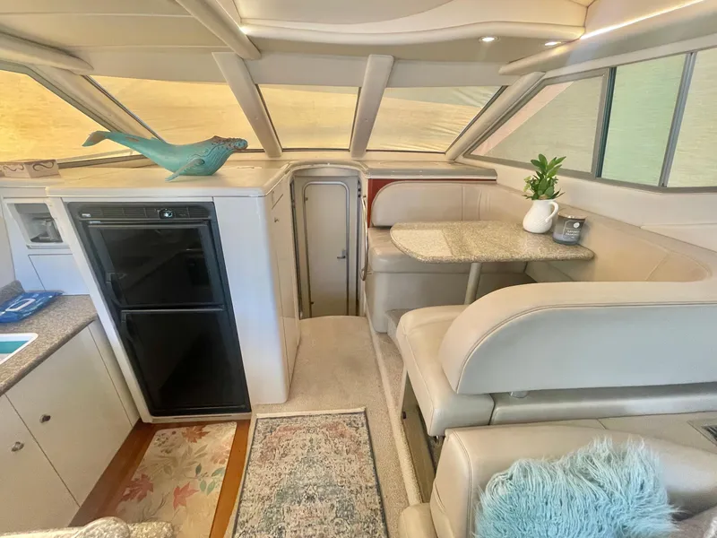 Slide: The Image of Luxurious interior of 1998 Maxum 4100 SCA yacht with elegant seating and decor. - 24