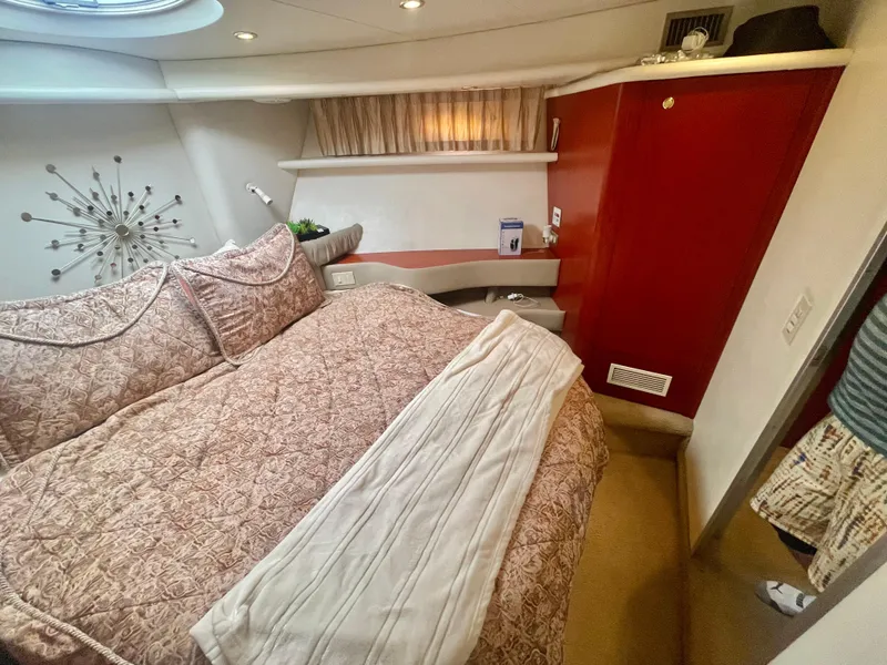 Slide: The Image of Luxurious bedroom interior of 1998 Maxum 4100 SCA yacht with elegant bedding and decor. - 28