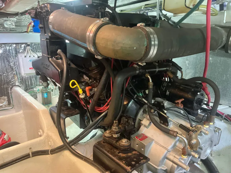 Slide: The Image of Engine compartment of a 1998 Maxum 4100 SCA boat, showcasing mechanical components and wiring. - 30