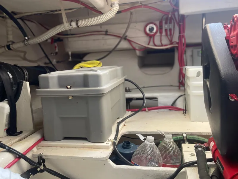 Slide: The Image of Engine room of 1998 Maxum 4100 SCA boat with wiring and storage containers. - 32