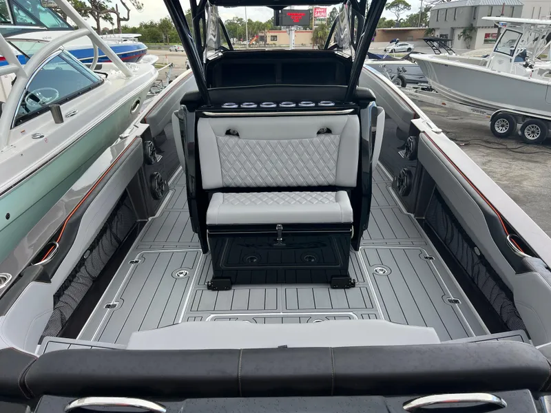Slide: The Image of 2026 Nor-Tech 340 Sport boat interior with sleek seating and modern design. - 11