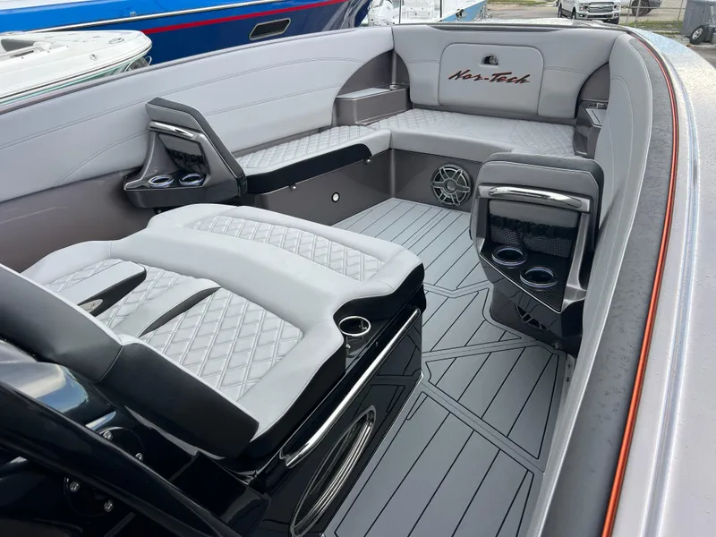 Slide: The Image of Luxurious interior of 2026 Nor-Tech 340 Sport boat with sleek seating and modern design. - 16