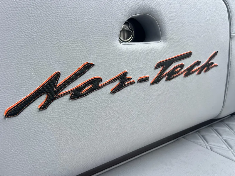 Slide: The Image of Nor-Tech 340 Sport 2026 logo on gray leather upholstery. - 17