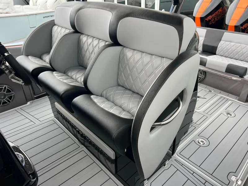 Slide: The Image of 2026 Nor-Tech 340 Sport boat interior with luxurious seating and modern design. - 21