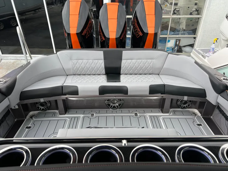 Slide: The Image of 2026 Nor-Tech 340 Sport boat interior with sleek seating and powerful engines. - 24